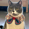 Load image into Gallery viewer, Grey British shorthair cat wearing cherry patchwork print oversized bow collar bandana with blue denim and red zigzag trim