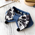 Load image into Gallery viewer, Blue denim pet collar with black and white cartoon print bow and pom-pom detail