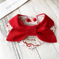 Load image into Gallery viewer, Bold red bow pet bandana collar with printed pattern styled on wooden surface