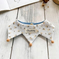Load image into Gallery viewer, Flat lay of floral pattern reversible pet bandana with wooden bead trim