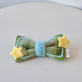 Load image into Gallery viewer, Green plush bow tie bandana with yellow star accents close up flat lay for cat and small dog birthday outfit