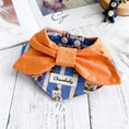 Load image into Gallery viewer, Bright orange bow pet collar with printed denim bandana styled on wooden surface