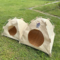 Load image into Gallery viewer, Side view of the Gravipaw embroidered cat tent bed on grass with the entrance flap open