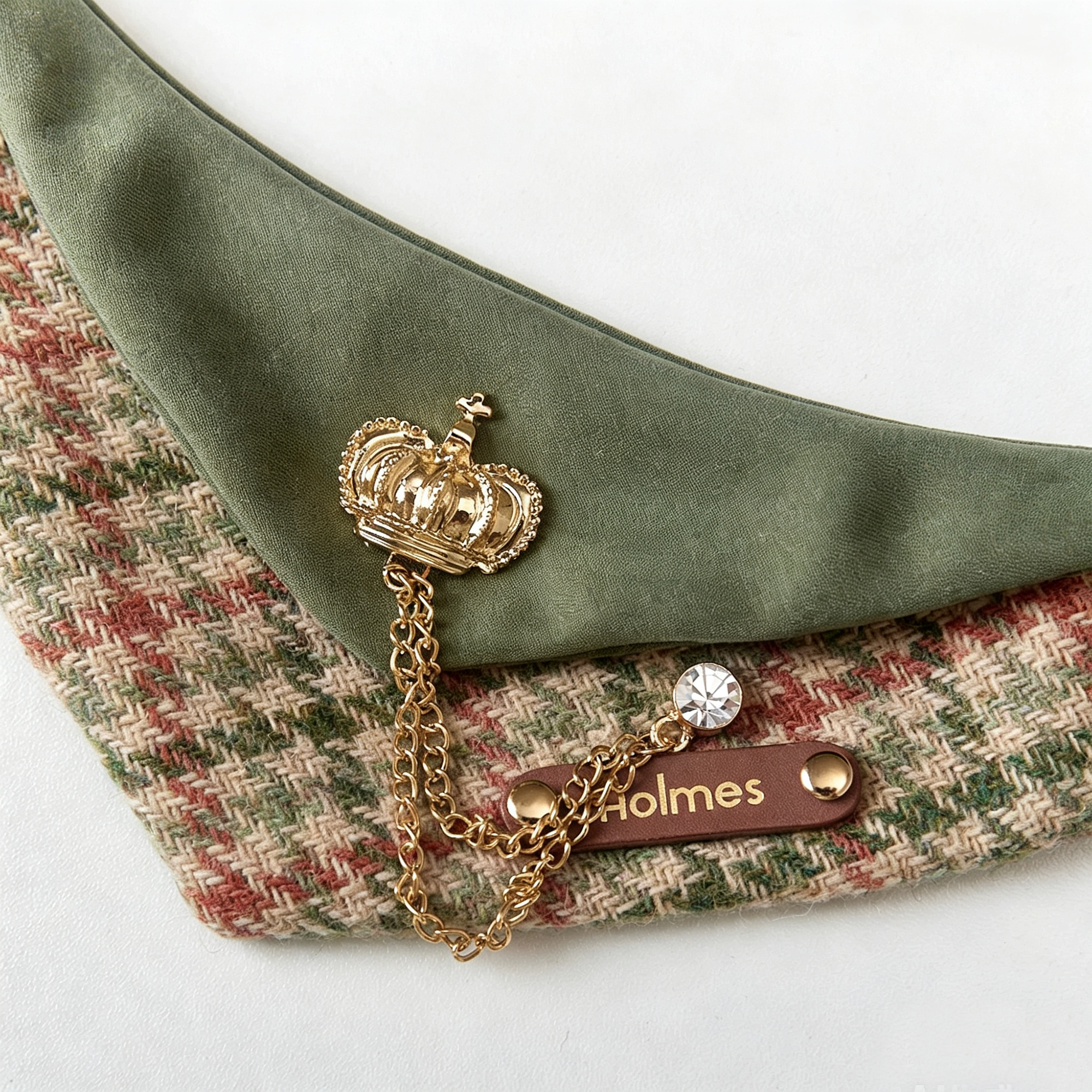 Close-up of GraviPaw personalized leather name tag engraved Holmes on houndstooth bandana