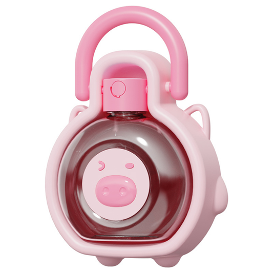 Bean-Shaped Pig Travel Pet Bottle front view - pink pig-faced water bottle with integrated drinking bowl | GraviPaw
