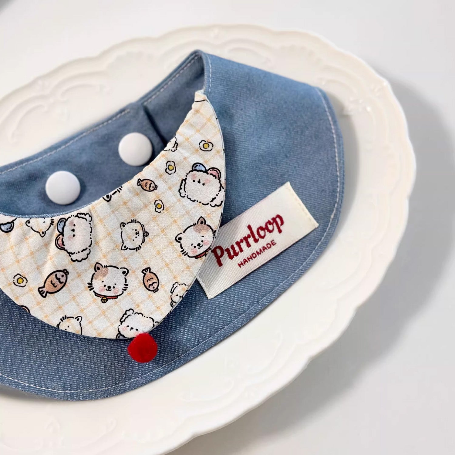 Soft cotton blue cartoon print pet collar with red button detail lifestyle shot