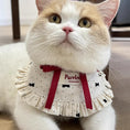 Load image into Gallery viewer, Orange and white cat wearing cream dot ruffle collar with red ribbon detail
