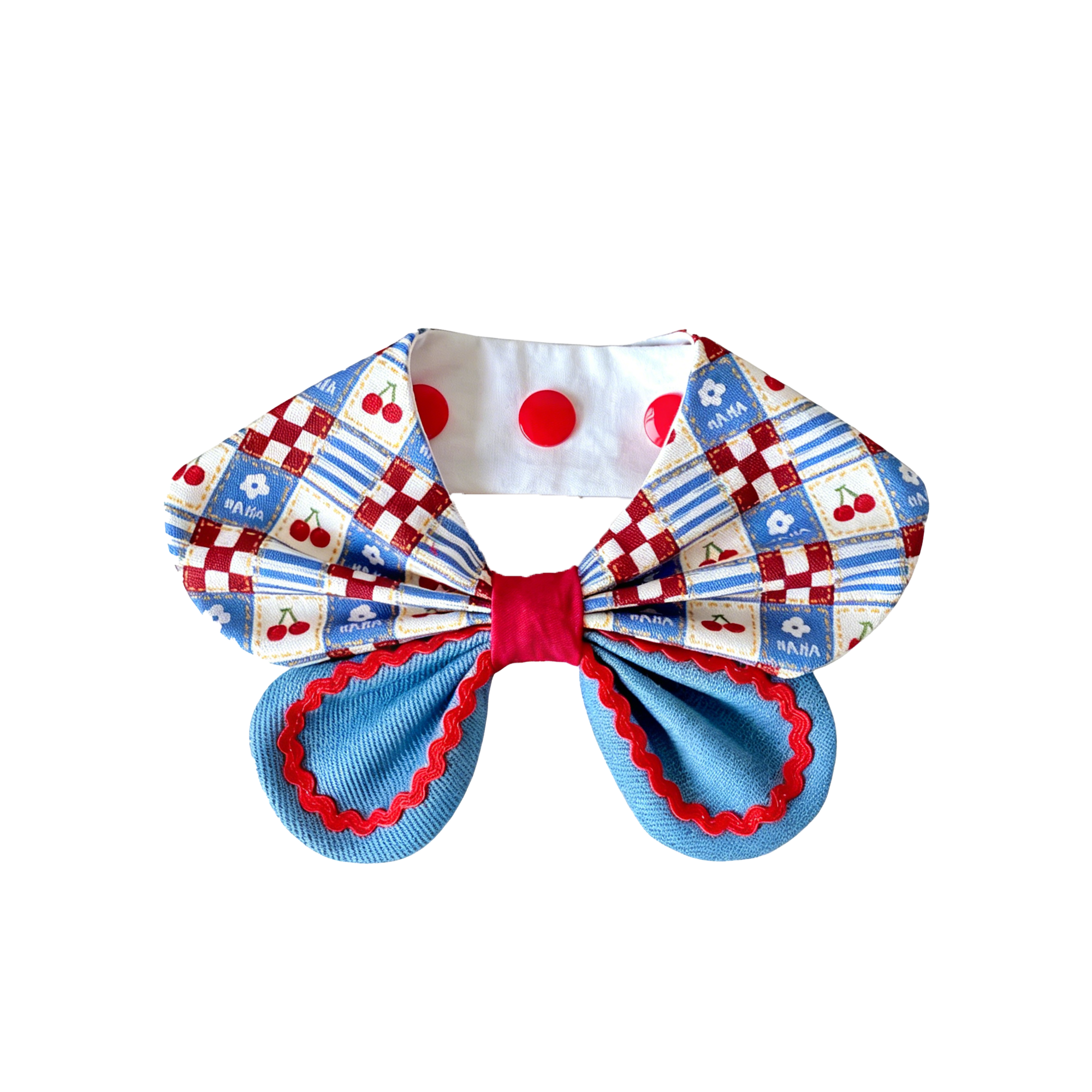 Front view close up of cherry patchwork print oversized bow dog collar bandana showing red polka dot snap buttons and layered bow detail