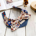 Load image into Gallery viewer, Circus-inspired bow pet collar with denim style base on wooden table
