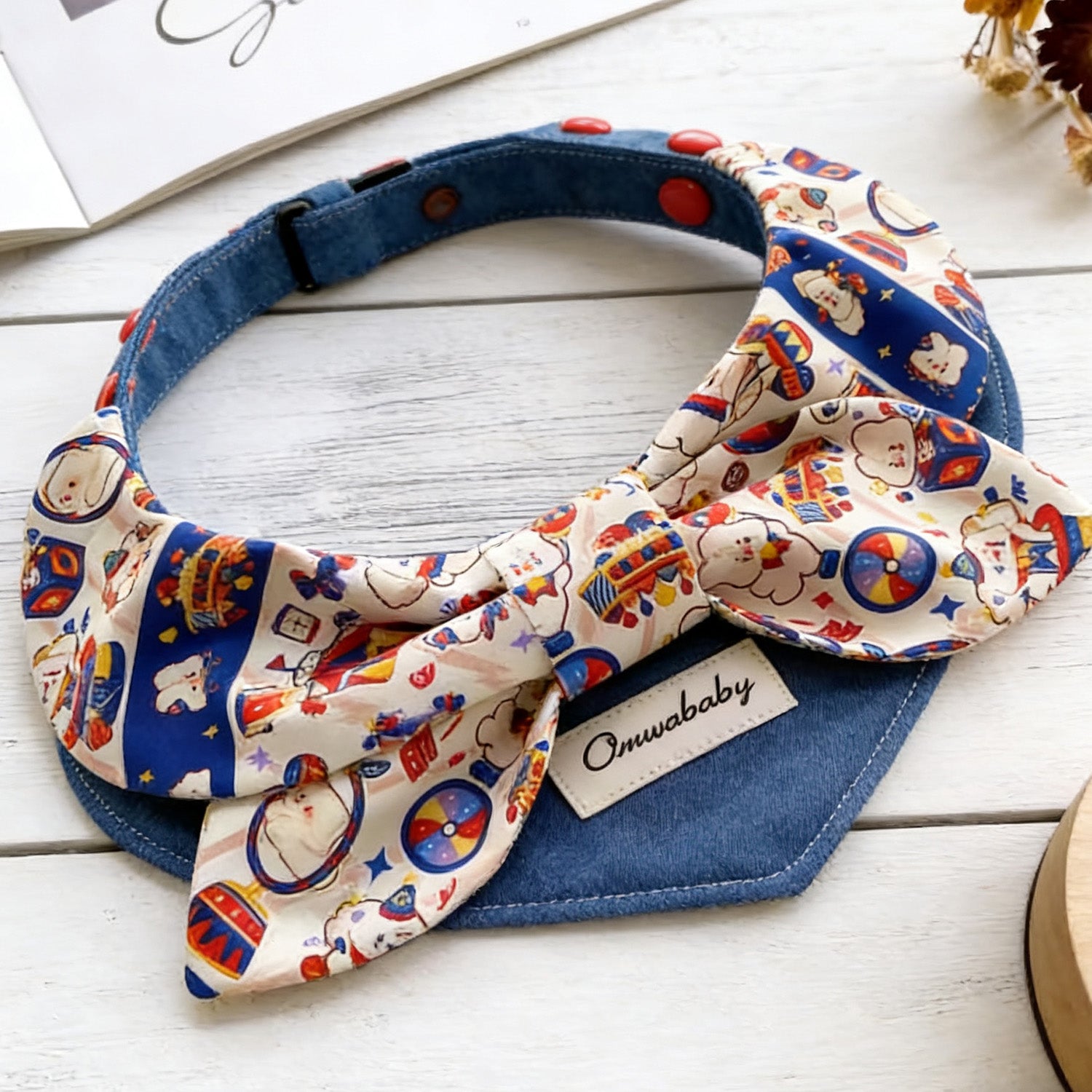 Close-up of colorful circus pattern bow detail on adjustable pet collar