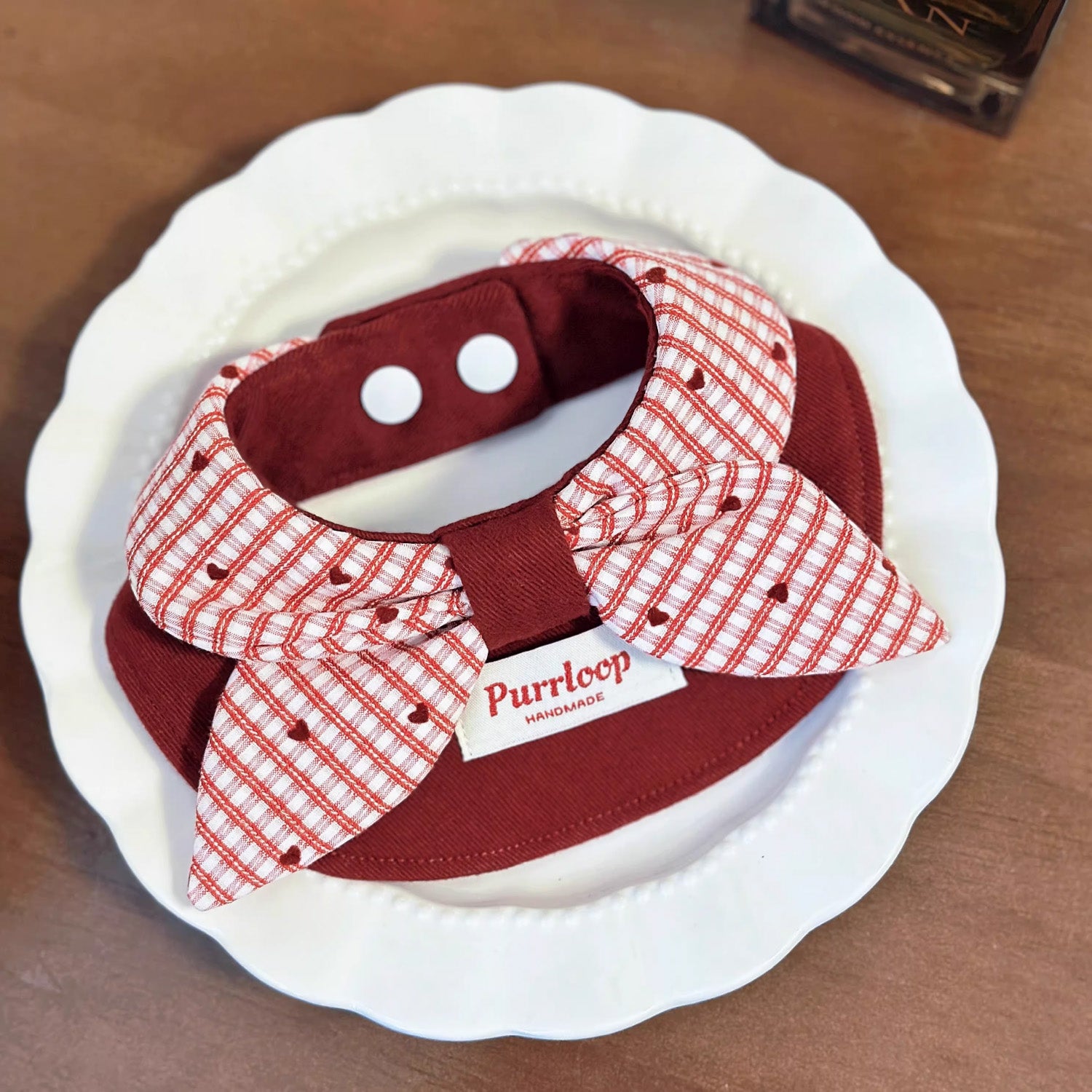 Soft cotton wine red bow bandana pet collar with red gingham detail lifestyle shot