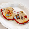 Load image into Gallery viewer, Vintage teddy bear print pet collar with red trim styled on white plate
