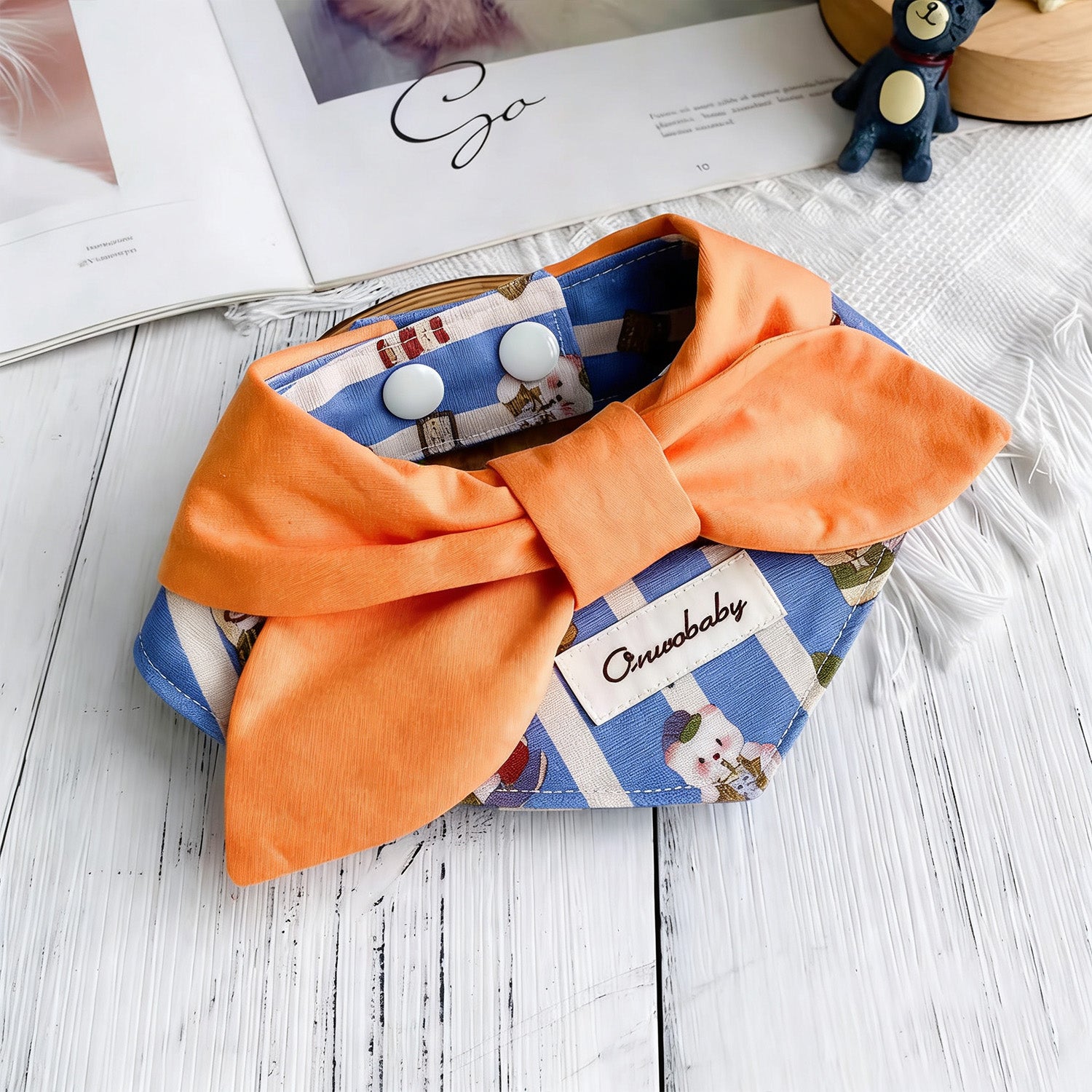 Soft cotton orange bow pet collar with printed denim pattern lifestyle shot