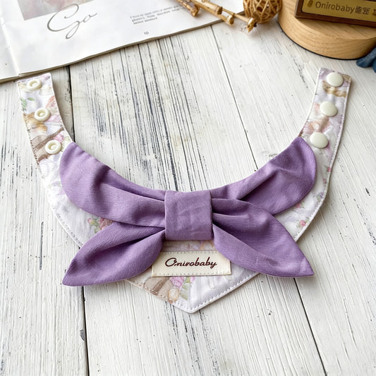 Purple lavender bow pet collar with floral bandana styled on wooden surface
