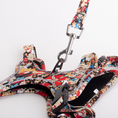 Load image into Gallery viewer, Side view of floral reflective dog harness with matching leash attached
