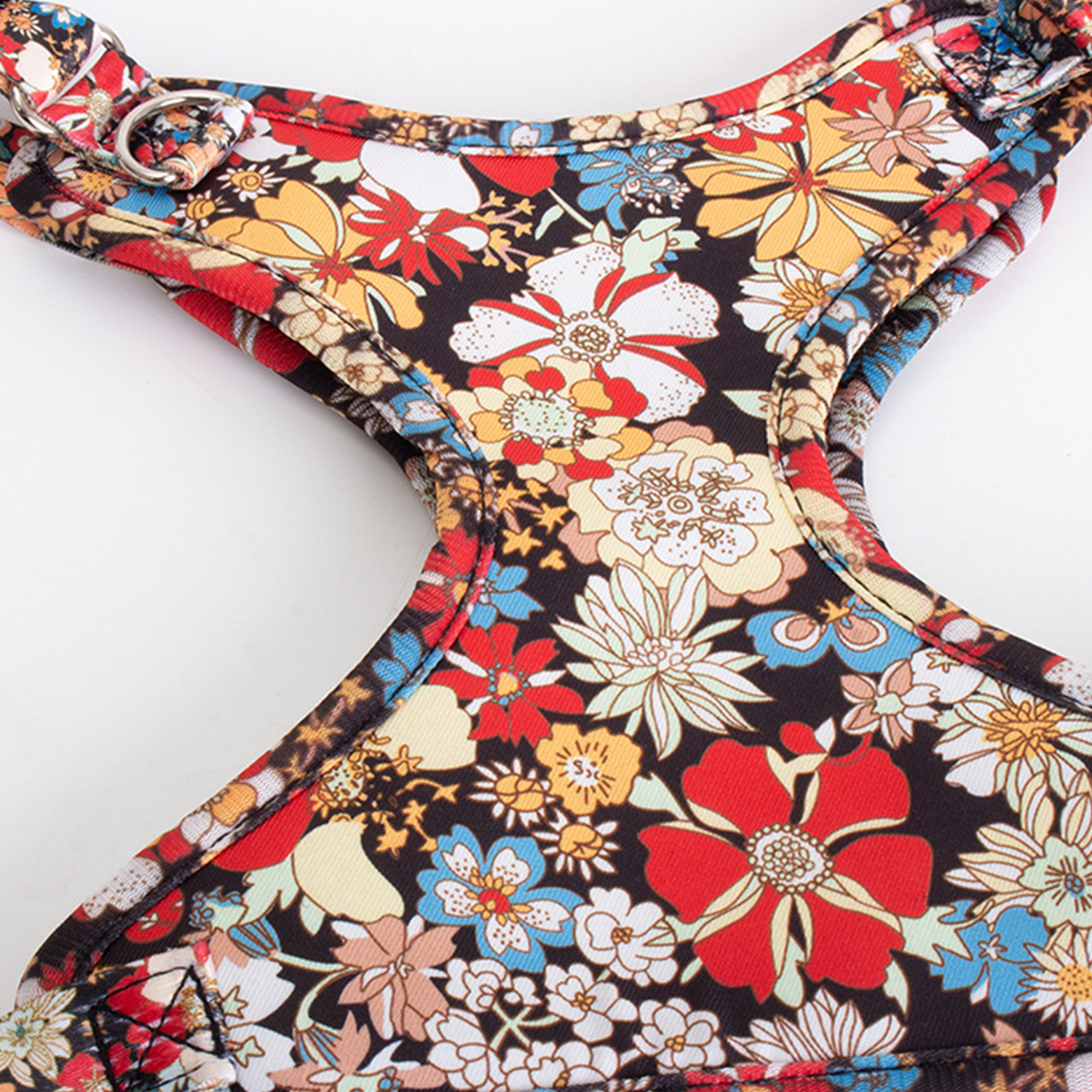 Flat lay of floral print reflective anti-pull dog harness with mesh lining