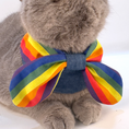 Load image into Gallery viewer, Grey cat wearing rainbow pride bow collar, front view, handmade denim pet bandana by GraviPaw
