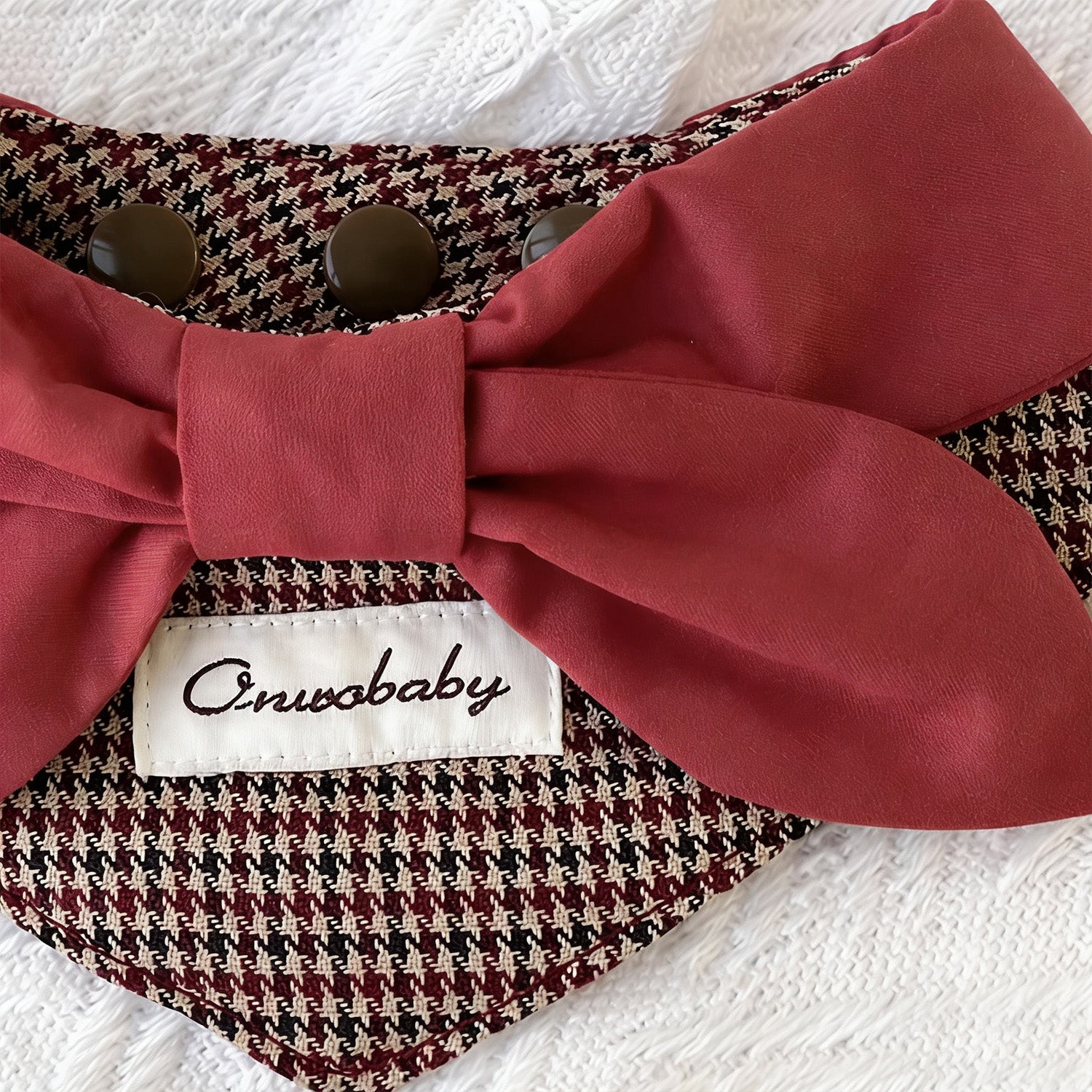 Elegant houndstooth pet bandana collar with red statement bow lifestyle shot