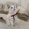 Load image into Gallery viewer, White kitten wearing French ruffle pet collar with elegant red ribbon detail
