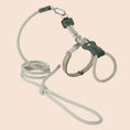 Load image into Gallery viewer, Beige lightweight adjustable cat harness and soft rope leash set coiled flat on white background with metal hardware
