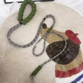 Load image into Gallery viewer, Green foam handle dog leash with patterned nylon rope laid on rug
