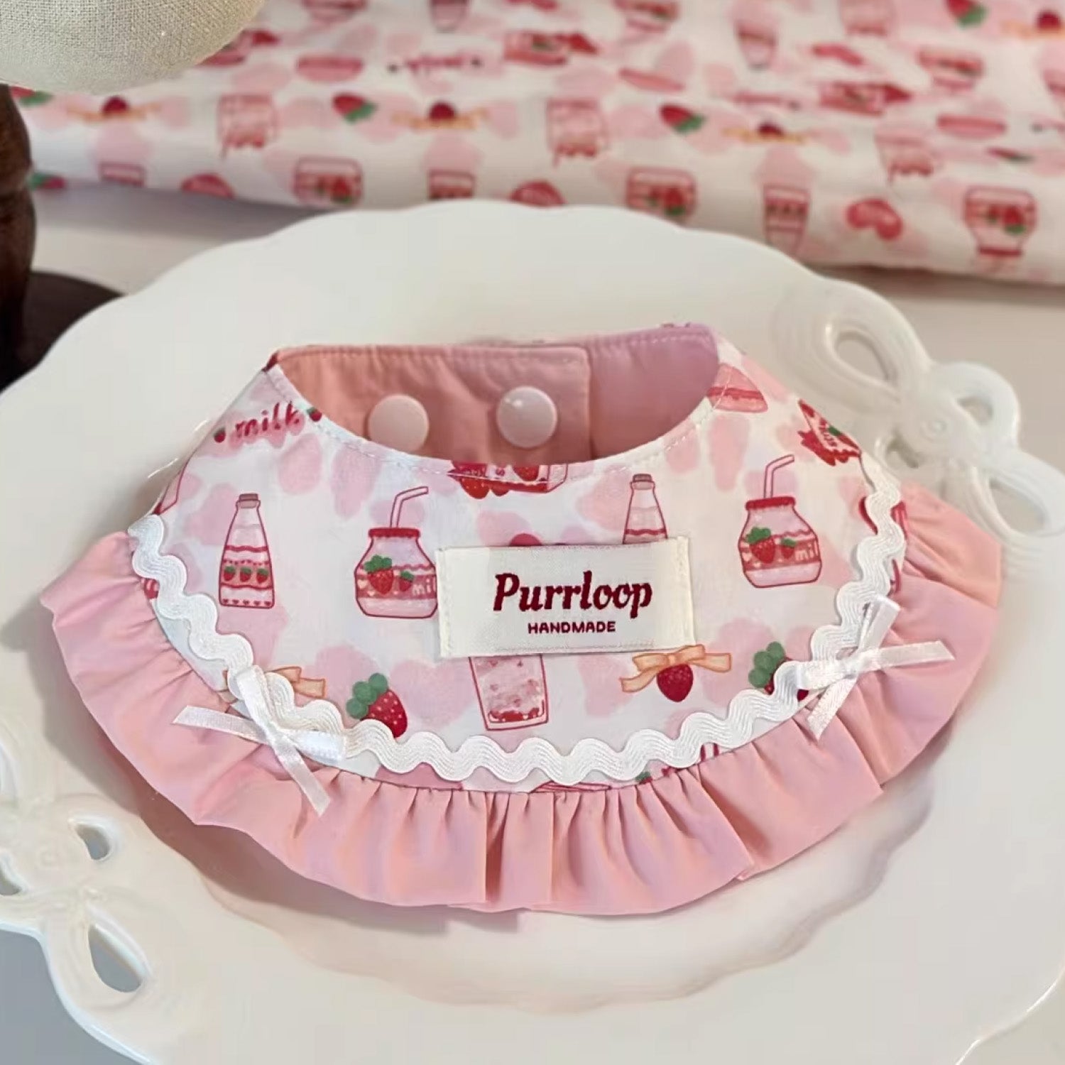 Cute pink strawberry milk bottle print bandana pet collar on white plate