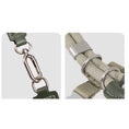 Load image into Gallery viewer, Close up of stainless steel carabiner clip and metal buckle hardware on beige adjustable cat harness
