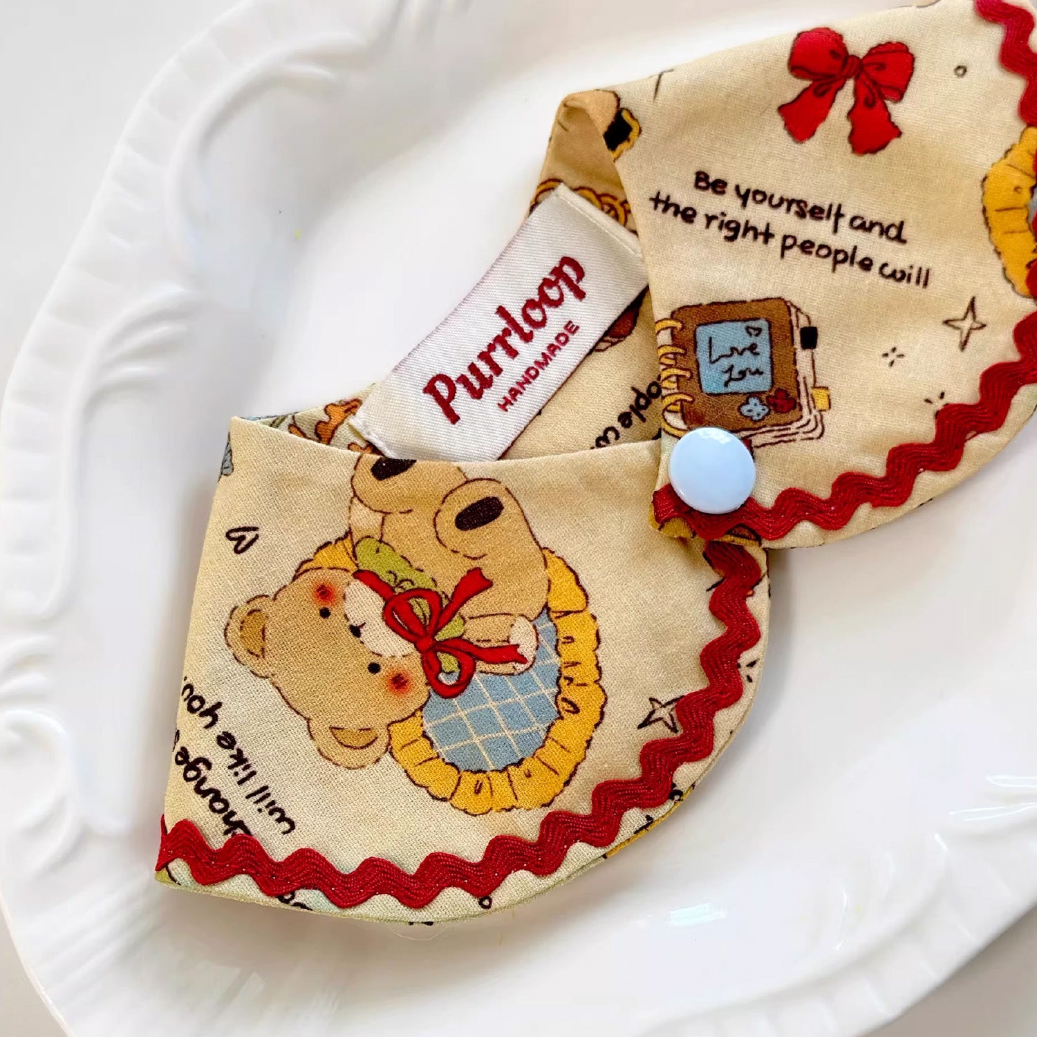 Warm-toned bear illustration pet bandana collar with snap-button closure