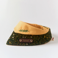 Load image into Gallery viewer, Side view of corduroy forest pet bandana showing botanical print texture and personalized engraved brown leather name tag
